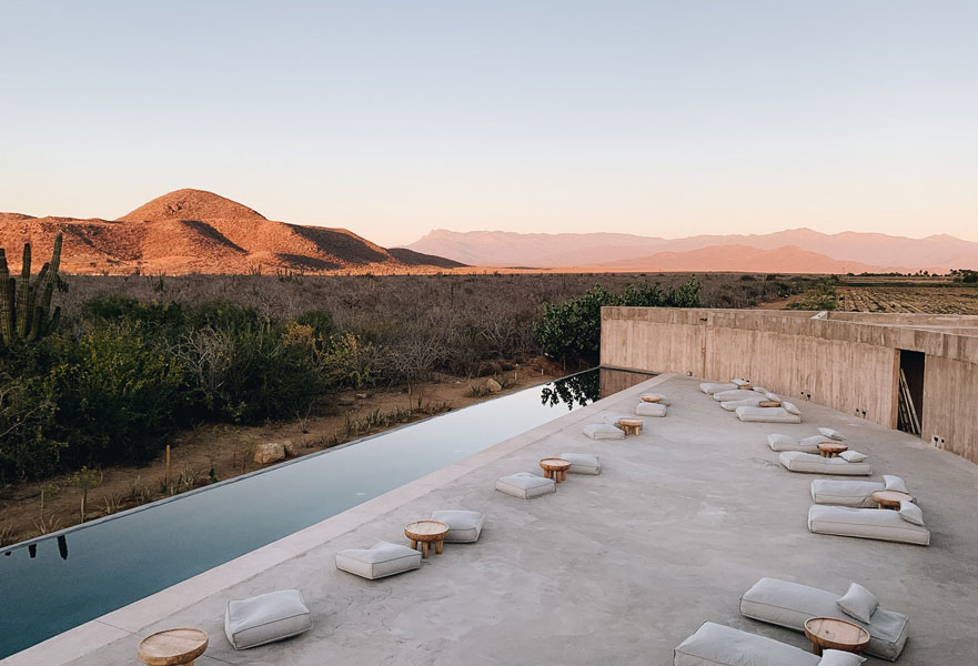 Pool space with cactus and mountain views at Paradero Todos Santos in Baja California Sur, Mexico.