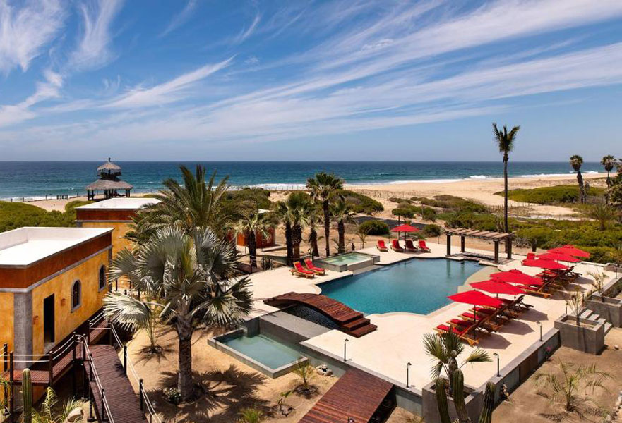 Pool area with ocean views and beach landscape at Villa Santa Cruz in Todos Santos, Baja California Sur, Mexico.