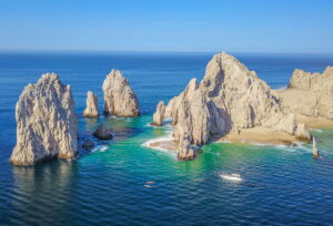 Lovers beach and The Arc at land's end with beautiful turquoise waters in Cabo San Lucas, Mexico.