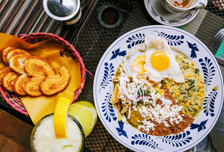 Mexican dish rajas con crema, beans and two fried eggs at Maria California restaurant in La Paz, Mexico.