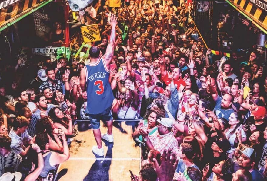 Rapper Nelly performing with hundreds of fans at El Squid Roe in Cabo San Lucas, Mexico.