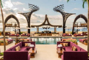 OMNIA Dayclub outdoor seating area with a pool in the middle and luxurious silver decoration, Los Cabos, Mexico.
