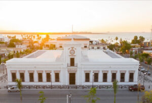 El Museo de Arte de Baja California Sur in La Paz, Mexico, aerial view during sunset and the ocean on the back.