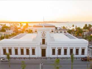 El Museo de Arte de Baja California Sur in La Paz, Mexico, aerial view during sunset and the ocean on the back.