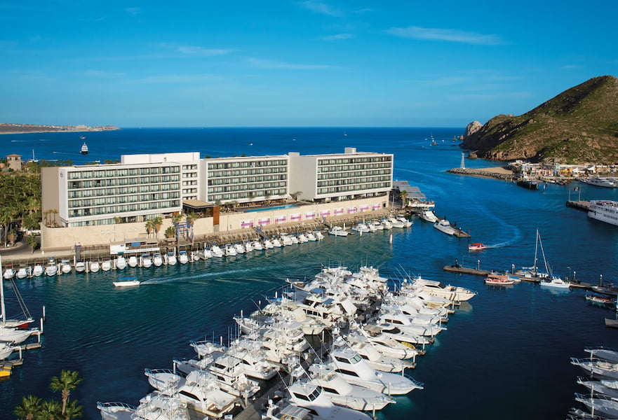 Aerial view of Breathless Resort with a private marina full of resting yachts, Los Cabos, Mexico.