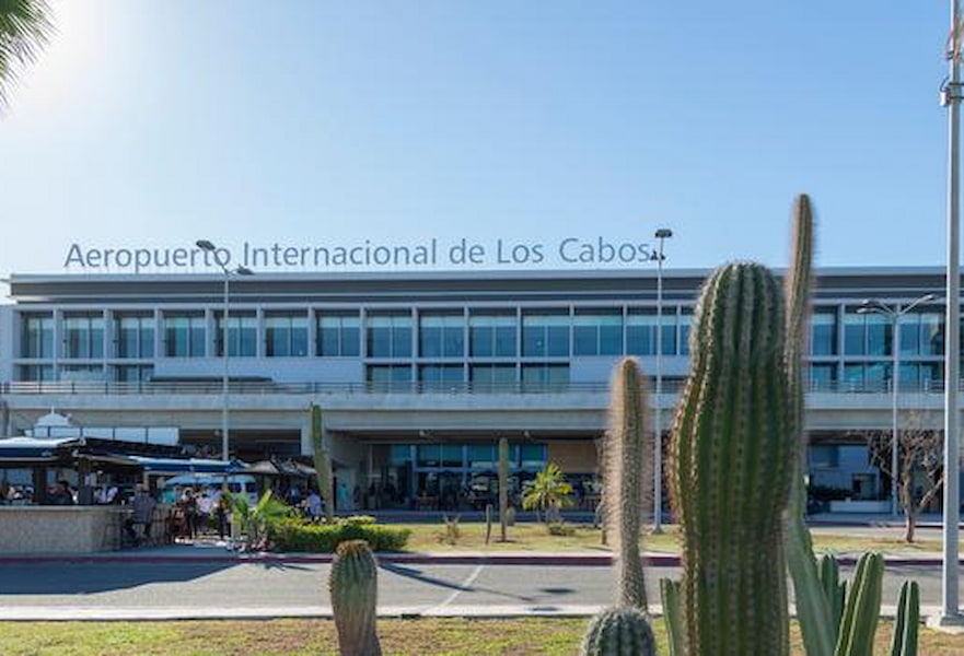 Los Cabos International Airport main entrance with cactuses and desert plant landscape