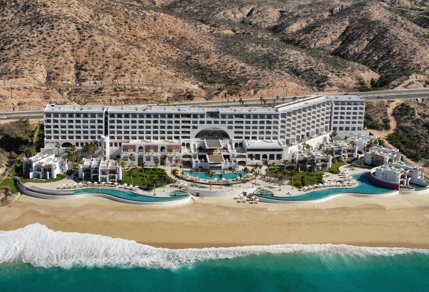 Aerial view of Marquis Resort, mountains on the background and secluded beach, Los Cabos, Mexico.