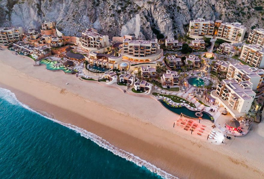Waldorf Astoria luxury resort aerial shoot, beachfront building and cliffside on the back, Los Cabos, Mexico.