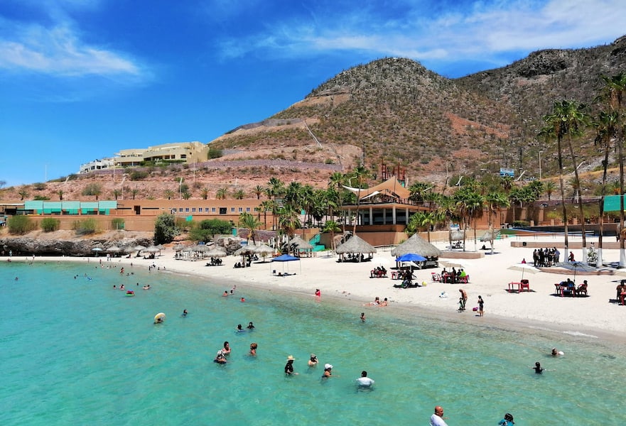 Scenic view of Beach in La Paz, BCS, featuring a picturesque coastal landscape with blue waters, and a beautiful sky.
