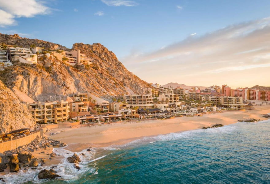 Panoramic view of Waldorf Astoria Los Cabos Pedregal luxury hotel with magnificent sunset tones at the Sea of Cortez