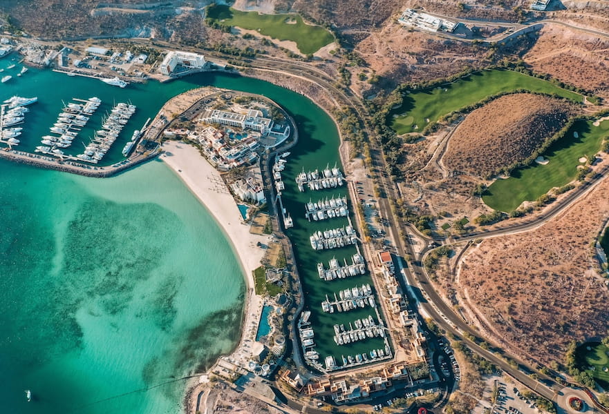 Puerta Cortés aerial view with the Marina, Golf course, Hotel Indigo, and the Sea of Cortez in La Paz Bay