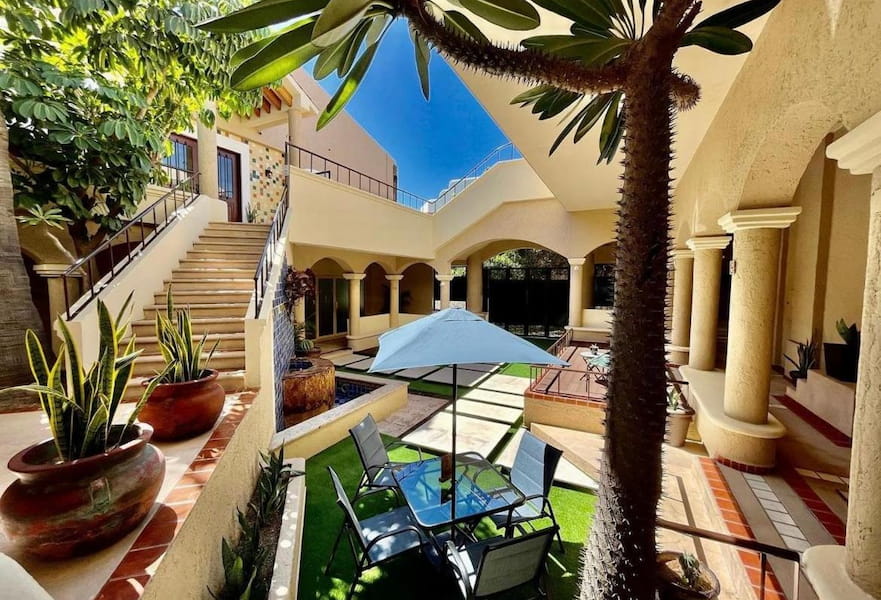 View of the central courtyard with seats and plant decor at Marisol Hotel Boutique in San José del Cabo