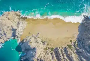 Beautiful aerial footage of Divorce Beach at Land's End in Cabo San Lucas, Mexico