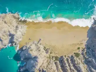 Beautiful aerial footage of Divorce Beach at Land's End in Cabo San Lucas, Mexico