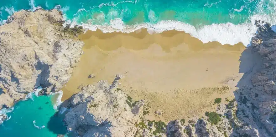 Beautiful aerial footage of Divorce Beach at Land's End in Cabo San Lucas, Mexico